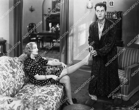 Johnny Downs helps Wanda McKay remove her nylons film What a Man 6942-11