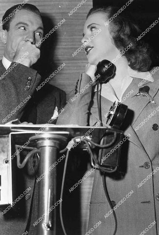 candid Deanna Durbin and co star on set on telephone film Christmas Holiday 7019-023