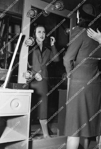 Deanna Durbin in full length mirror does makeup & wardrobe check 7019-033