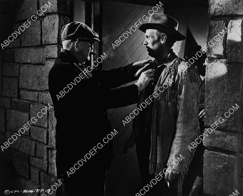 John Ford adjusts Richard Widmark's tie on set film Two Rode Together 7388-35
