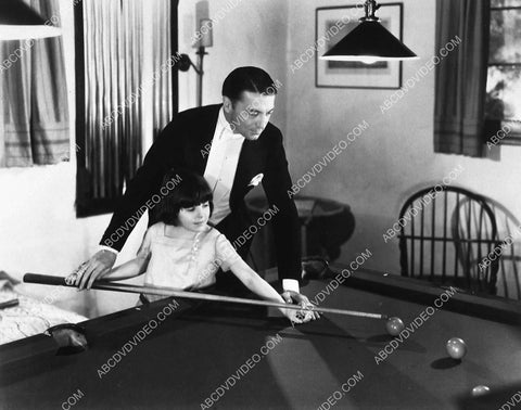candid Clive Brook teaching Mitzi Green some pool shots 7750-16