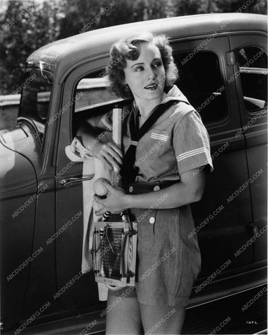 Madge Evans enjoys tennis in the great outdoors 7855-28