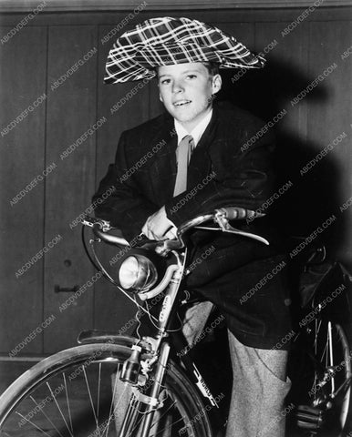 Ricky Nelson on bike in crazy big hat 8109-08