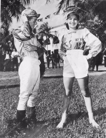 jockey Eddie Robart checks model Nannelle Rentz's new swimwear 81bx01-090