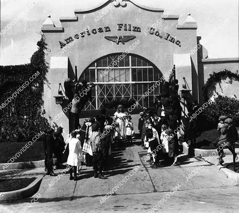 circa 1917 Mary Miles Minter w kids at front gate American Film Co.(Flying A Studios) 8207-6