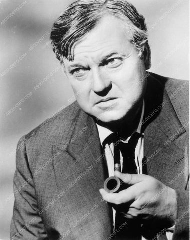 Orson Welles seated with pipe 8271-19