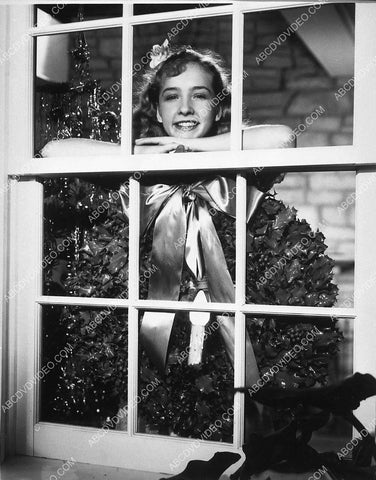 Bonita Granville looking out the window at Christmas time 8597-13