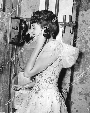 Jinx Falkenburg gets a telephone from her hubby on set film Meet Me on Broadway 8B11-297