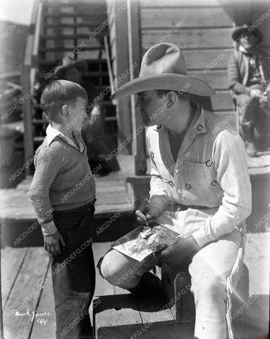 cowboy star Buck Jones signs autograph for fan 8b03-340
