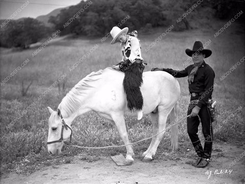 Buck Jones and cute cowgirl unknown film 8b03-363
