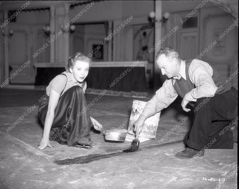 Ida Lupino helps crew member get set ready One Rainy Afternoon 8b4-393