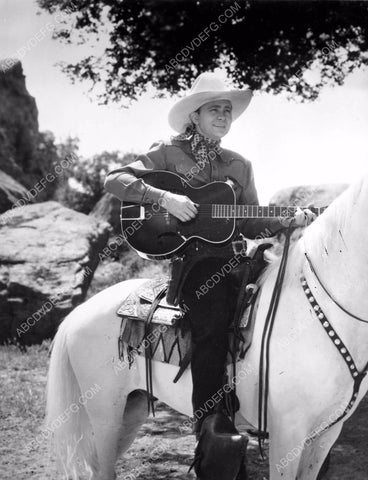 cowboy singer film star Tex Ritter strummin his guitar 8b4-617