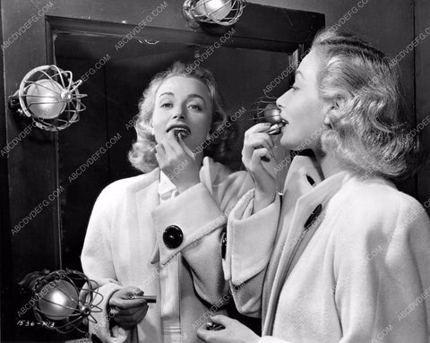 Universal star does makeup check and adjusts lipstick 8b6-059