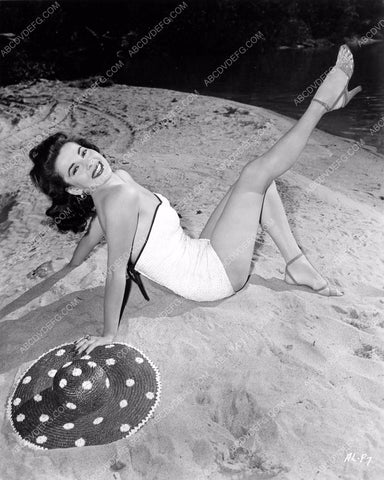 Abbe Lane kicks up her feet as she enjoys a little sand time 8b6-446