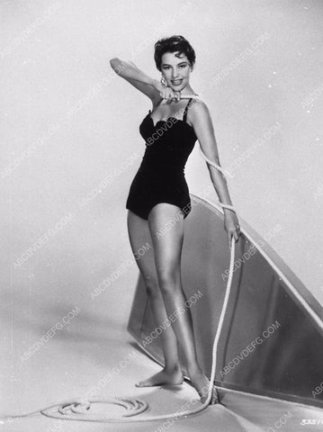 Cyd Charisse measuring a length of rope in her swimsuit 9202-13
