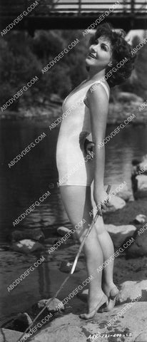 Jean Parker in her swimsuit standing on her toes 9272-10