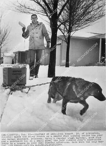 man uses German Shepherd dog to help with paper delivery route 9482-28