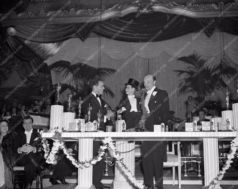 1938 Oscars Edgar Bergen Charlie McCarthy Frank Capra on stage aa1938-09</br>Los Angeles Newspaper press pit reprints from original 4x5 negatives for Academy Awards.