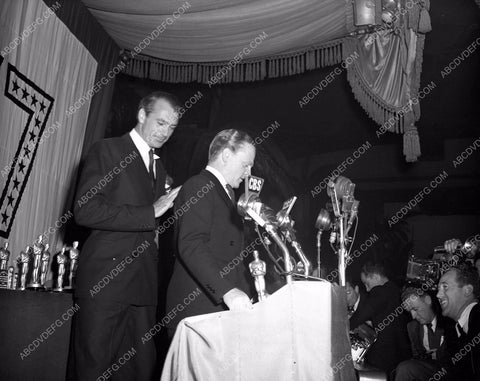 1942 Oscars candid James Cagney Gary Cooper at the podium aa1942-01