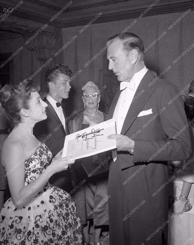1959 Oscars Gary Cooper gets program arriving Academy Awards aa1959-52</br>Los Angeles Newspaper press pit reprints from original 4x5 negatives for Academy Awards.