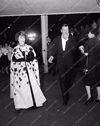 1960 Oscars John Wayne and wife arriving Academy Awards aa1960-99</br>Los Angeles Newspaper press pit reprints from original 4x5 negatives for Academy Awards.