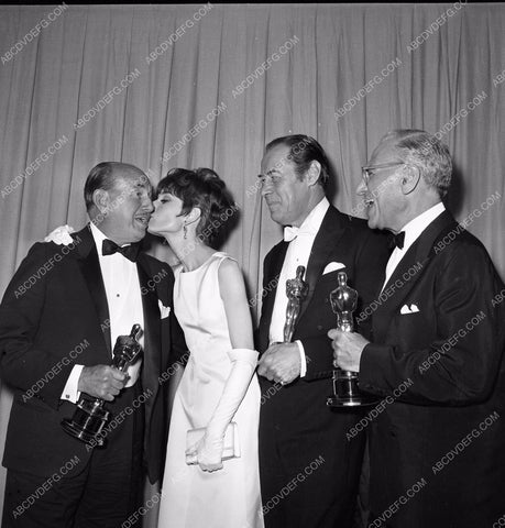 1964 Oscars Jack Warner Audrey Hepburn Rex Harrison George Cukor aa1965-03</br>Los Angeles Newspaper press pit reprints from original 4x5 negatives for Academy Awards.