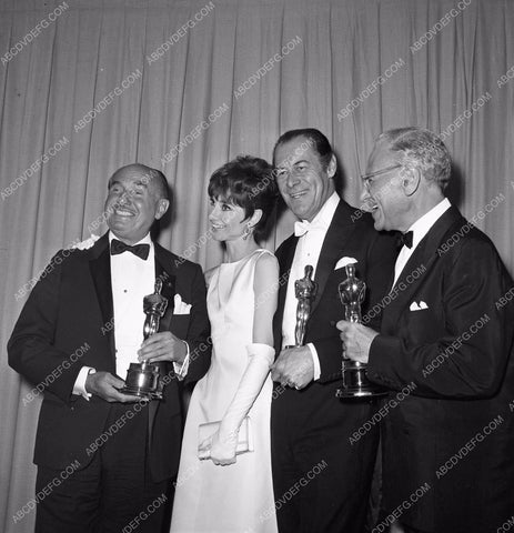 1964 Oscars Jack Warner Audrey Hepburn Rex Harrison George Cukor aa1965-04</br>Los Angeles Newspaper press pit reprints from original 4x5 negatives for Academy Awards.