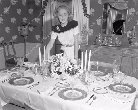 candid hHollywood Alice Faye preparing for guests at home afaye-02