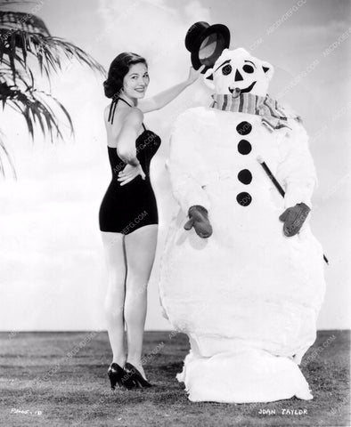 Joan Taylor does cute Christmas pinup with snowman 8b20-0325