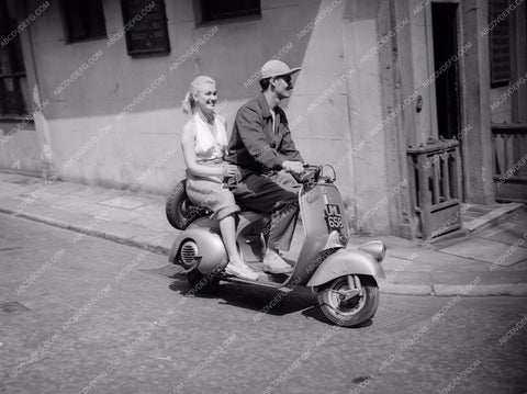 motor scootering around Susan Shaw 8b20-0621