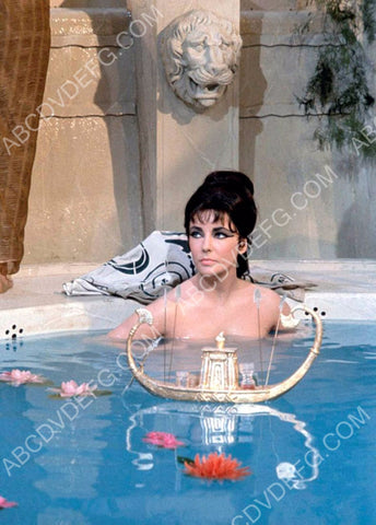 Elizabeth Taylor playing w toy boats film Cleopatra 8b20-0701