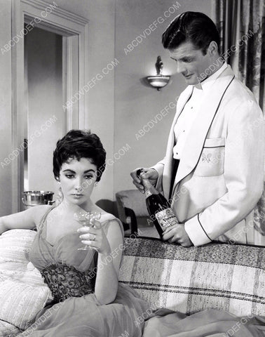 Roger Moore offers champagne Elizabeth Taylor Last Time I Saw Paris 8b20-0960