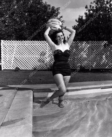 Jane Russell playing with a beachball in the swimming pool 8b20-10055