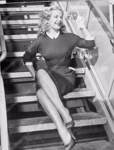 Cleo Moore and a mask go for an airplane ride 8b20-10446