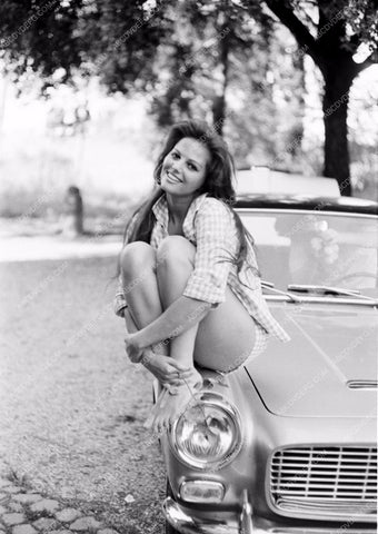 sexy Claudia Cardinale sitting on the fender of her car 8b20-10501