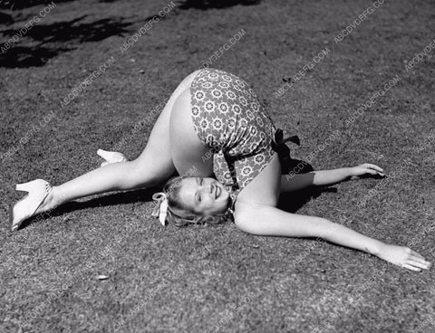 Dorothy Andre does her contortionist exercises in backyard 8b20-11893