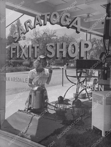 Donna Reed looking at storefront window 8b20-11920
