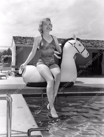 cute Ellen Drew and her infaltable horse out by the swimming pool 8b20-11967