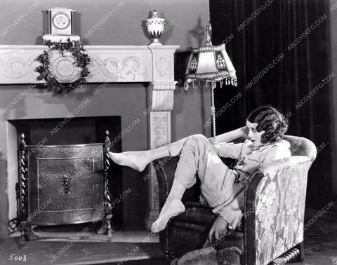 Fay Webb sitting by the fireplace 8b20-12044