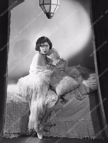 Renee Adoree sitting on her bed 8b20-12512