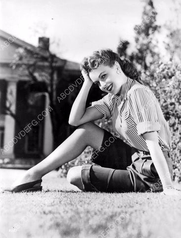 lovely Frances Gifford sitting in the grass in the front yard 8b20-12597