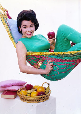 Annette Funicello w fruit basket & book laying in a hammock 8b20-13038