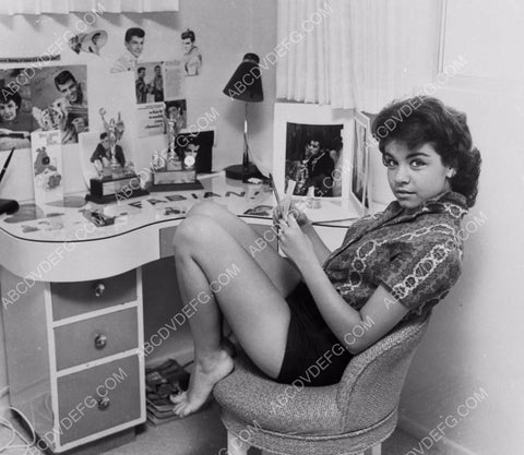 Annette Funicello at her bedroom desk reading a letter 8b20-13156