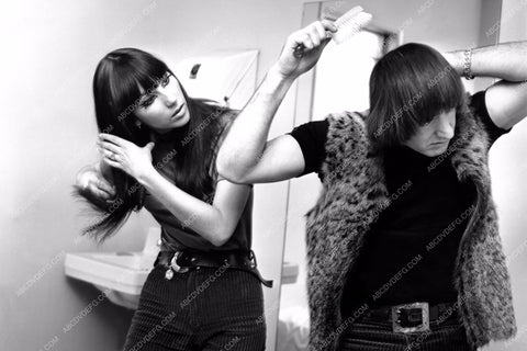 candid Cher Sonny Bono brushing their hair 8b20-14038