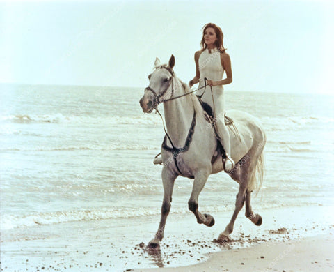 lovely Diana Rigg riding her horse on the beach 8b20-14063