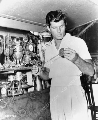 candid Dewey Martin lokking at antique knick knacks 8b20-14220