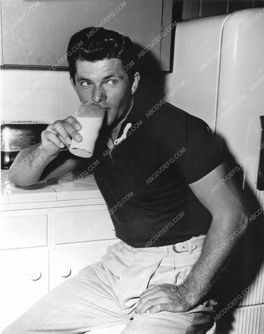 Dewey Martin enjoys a glass of milk in the kitchen 8b20-14223