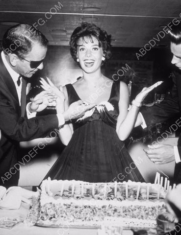 Frank Sinatra removes birthday cake frosting from Natalie Wood's dress with Robert Wagner 8b20-14959