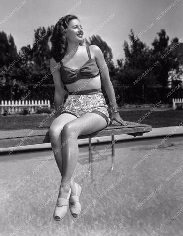 beautiful Barbara Stanwyck sitting on the diving board 8b20-15528
