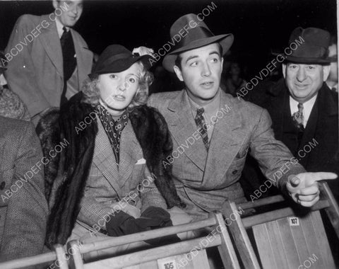 great candid Barbara Stanwyck Robert Taylor at sporting event 8b20-15534